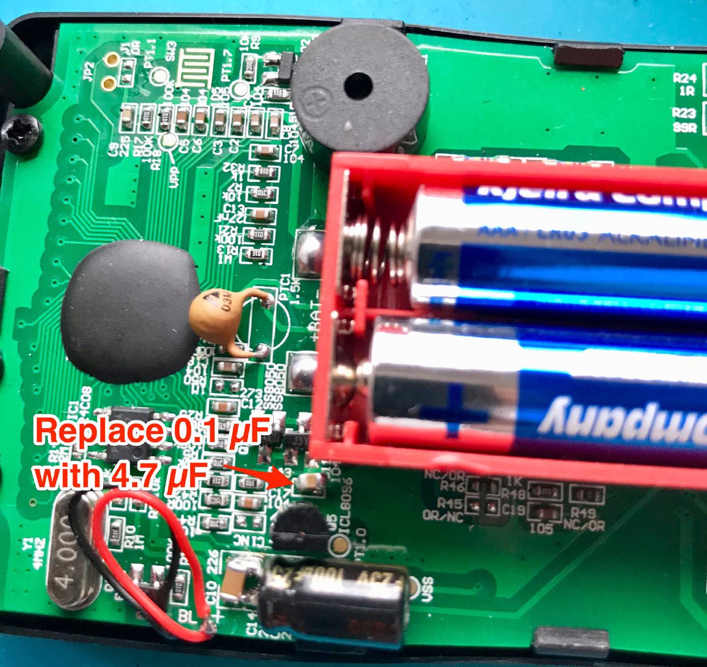 The board with a red arrow marking the 0.1 uF capacitor beside the ICL8069 reference, labelled to be replaced with 4.7 uF