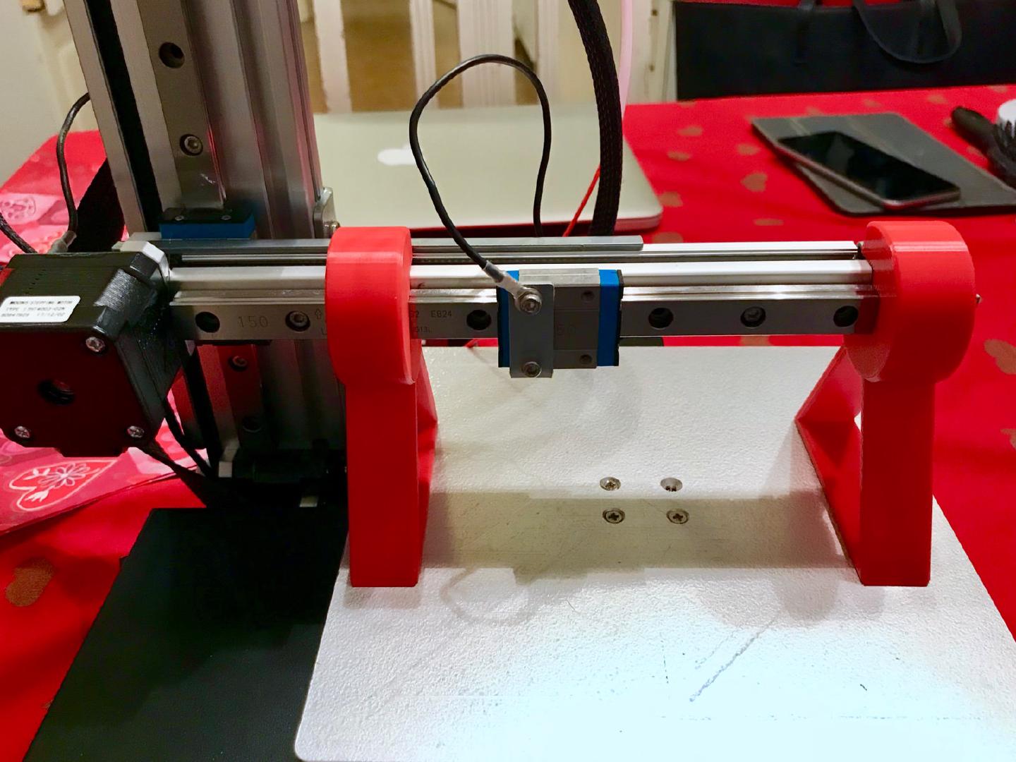 Both calibration stands placed at either end of the Cetus3D’s Y-axis rail, resting on the print bed to show up any tilt