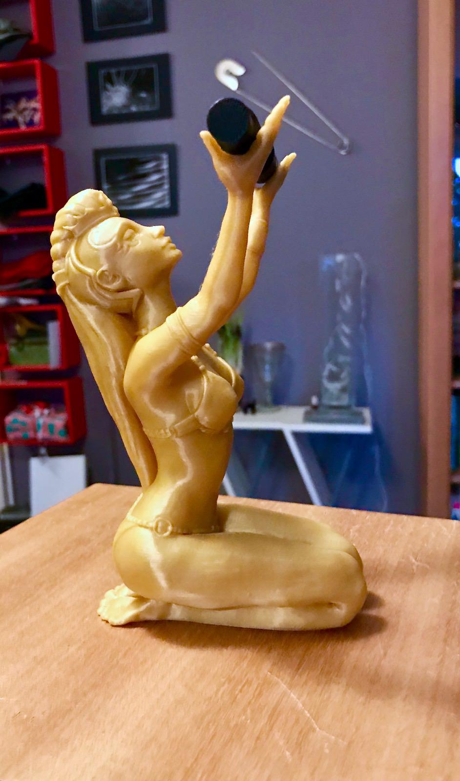 A tall gold print of the Sorceress figure, made after the calibration and needing no raft