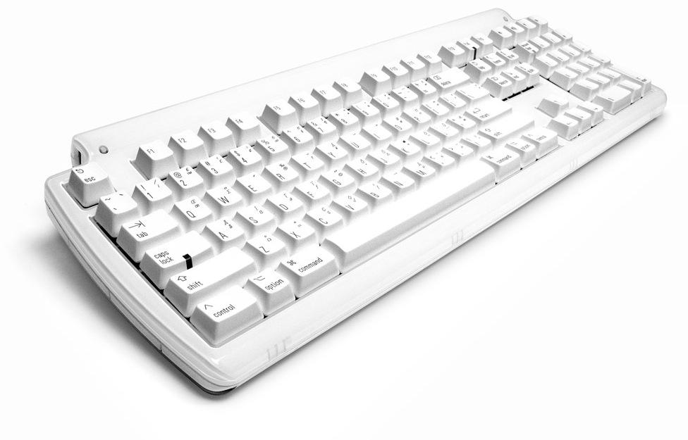 The white Matias Tactile Pro seen at an angle, styled after the old Apple keyboards with Mac command and option keys