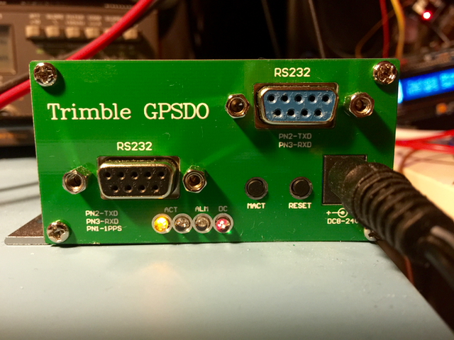The Trimble GPSDO board’s front panel, with two RS232 ports, ACT, ALM and DC indicator lights and a DC 8-24 V input