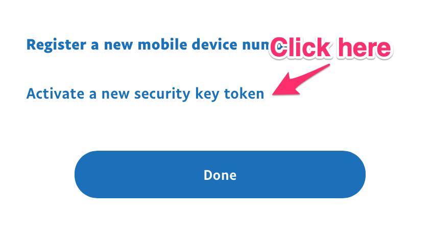 The security key panel with an arrow pointing at the Activate a new security key token link