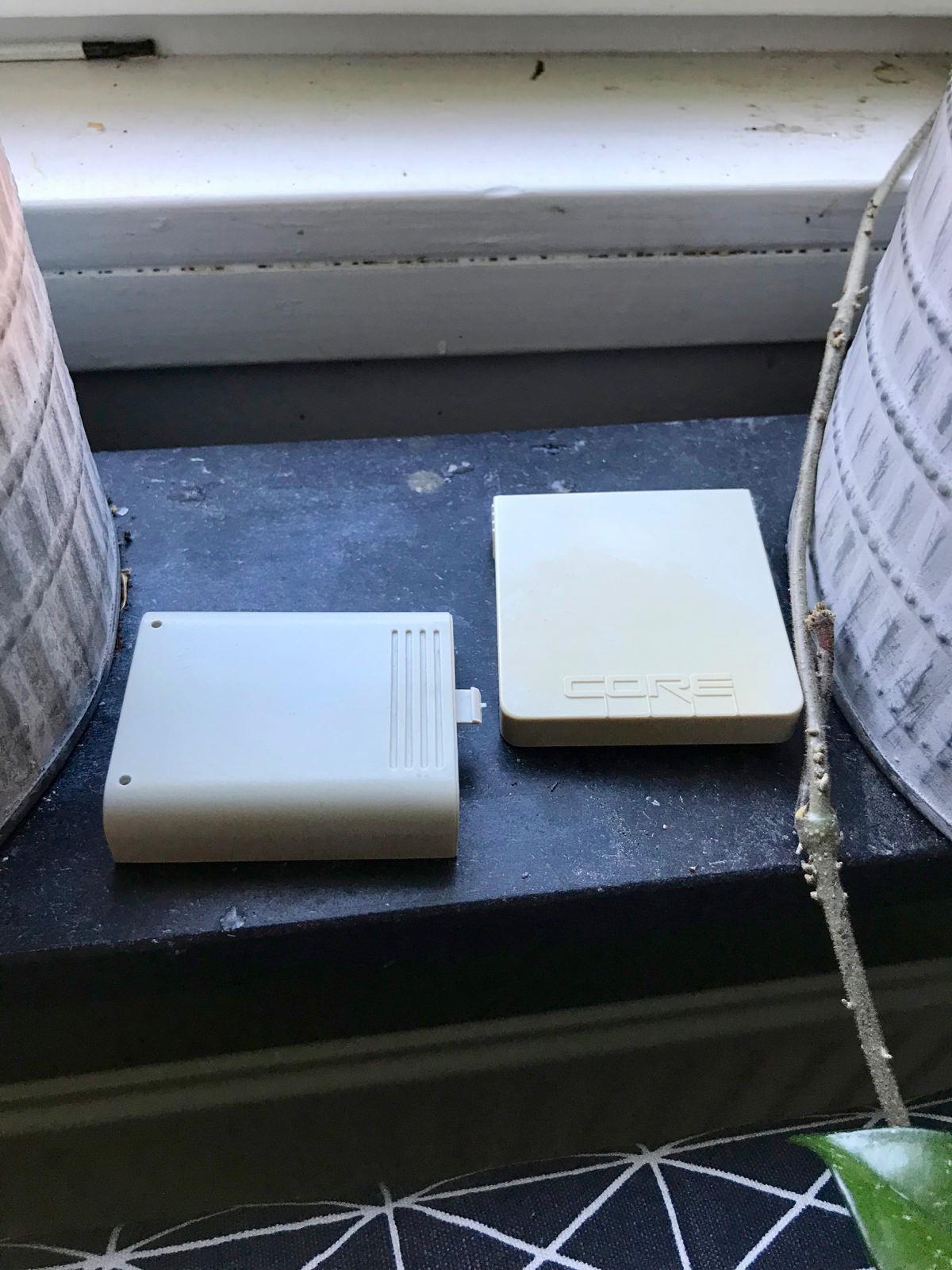 The two covers left on a windowsill to weather in sunlight, the waxed battery cover on the left and the untreated Core front cover on the right